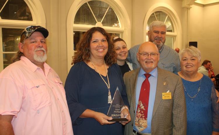 Terri Phillips, (second from left) stands with her husband Bobby Phillips (front row from from left) Jimmy Sparks and Darlene Smith and (back row, from left) Bree Faulkner and James Smith after she was selected as the 2022 Lake City-Columbia County Chamber of Commerce Outstanding Citizen of the Year during the organization’s annual Business Excellence Awards Ceremony on Monday night. (TONY BRITT/Lake City Reporter)