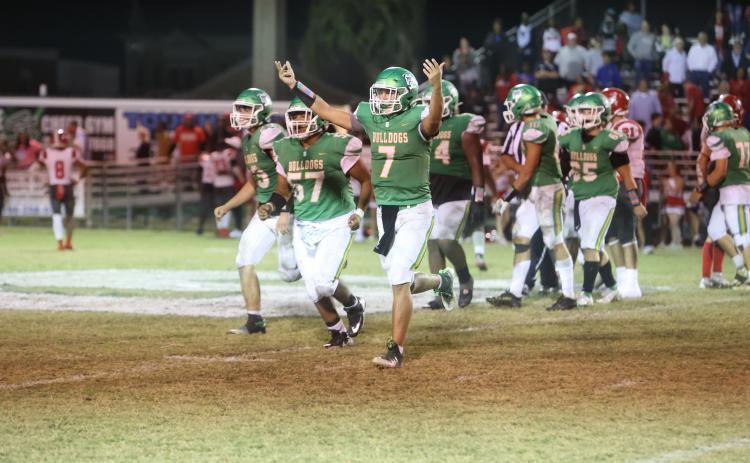 Suwannee quarterback Bronsen Tillotson celebrates as he runs off the field in the closing seconds of the Bulldogs’ 10-7 win against  Bradford Friday night at Langford Stadium. (PAUL BUCHANAN/Special to the Reporter)