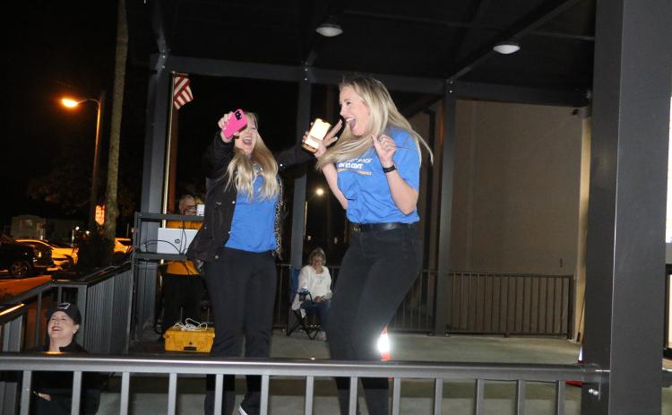 Dennille Decker (right) and Diana Swisher jump for joy as the final returns are announced Tuesday night and the Columbia County School District’s half-cent sales tax referendum was approved. (MORGAN MCMULLEN/Lake City Reporter)