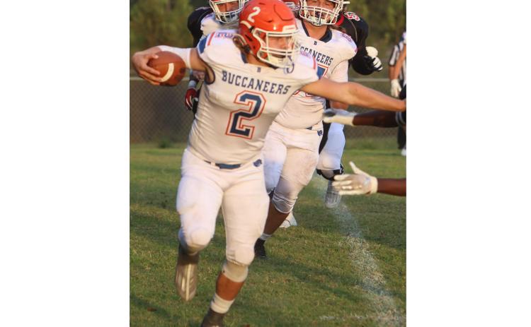Branford running back Caden Coker uses a stiff arm earlier in the season. (FILE)
