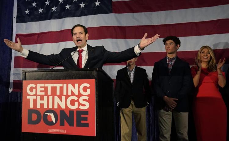 Sen. Marco Rubio celebrates with his family as he talks to supporters during an Election Night party Tuesday in Miami. (WILFREDO LEE/Associated Press