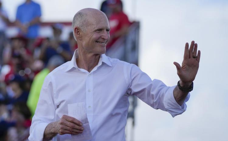 Sen. Rick Scott arrives to speak before former President Donald Trump at a campaign rally in support of the campaign of Sen. Marco Rubio on Nov. 6. (REBECCA BLACKWELL/AP File)