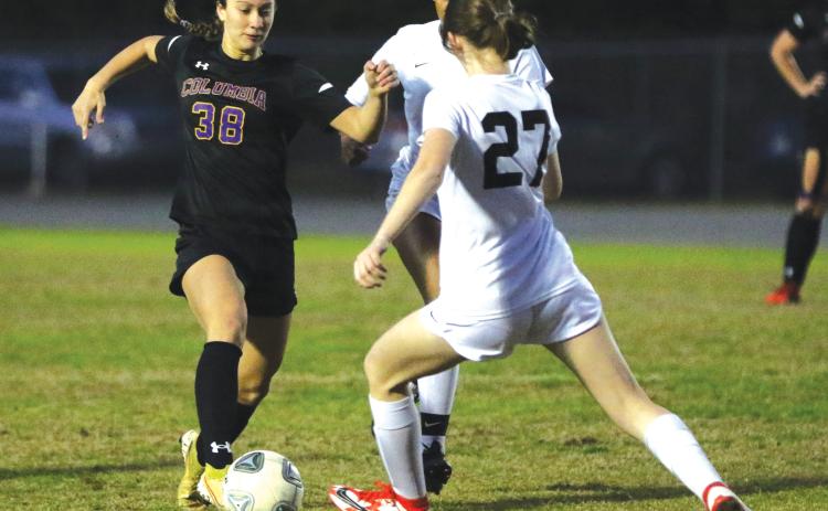 Columbia’s Skyler Ziegaus pushes the ball up the field against Leon last season. (FILE)