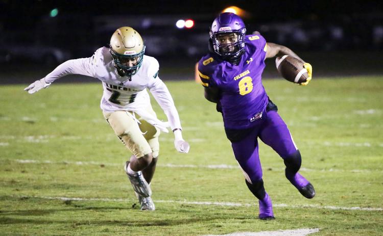 Columbia receiver Tray Tolliver runs up the field after a catch against Lincoln in the Region 1-3S quarterfinals on Nov. 11. (BRENT KUYKENDALL/Lake City Reporter)