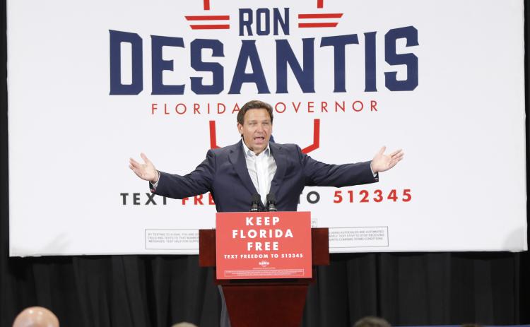 Gov. Ron DeSantis gestures as he addresses 1,200 supporters during a ‘Keep Florida Free Pit Stop’ at Florida Gateway College’s Howard Center on Thursday. (JAMIE WACHTER/Lake City Reporter)