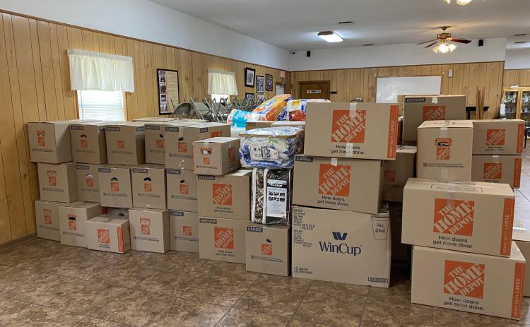 Boxes of supplies sit ready to be shipped to Fort Myers last month after the devastation of Hurricane Ian swept through southwest Florida. (COURTESY)