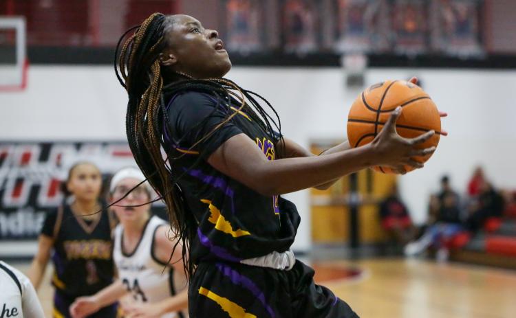 Columbia guard Eriel Baker rises for a layup Friday night against Fort White. (BRENT KUYKENDALL/Lake City Reporter)