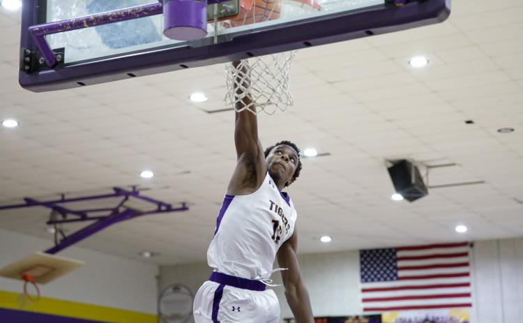 Columbia forward Seth Stockton dunks against Clay on Dec. 7. (BRENT KUYKENDALL/Lake City Reporter)