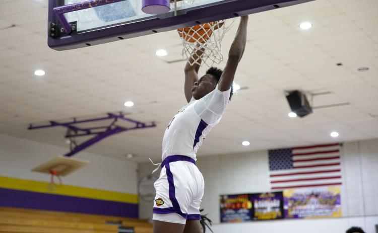 Columbia forward Ty'jahn Wright dunks against Clay on Dec. 7. (BRENT KUYKLENDALL/Lake City Reporter)