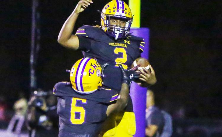 Columbia running back Tony Fulton (2) celebrates with receiver Tray Tolliver (6) after scoring a touchdown against Choctawhatchee in the Region 1-3S final last Friday. (BRENT KUYKENDALL/Lake City Reporter)