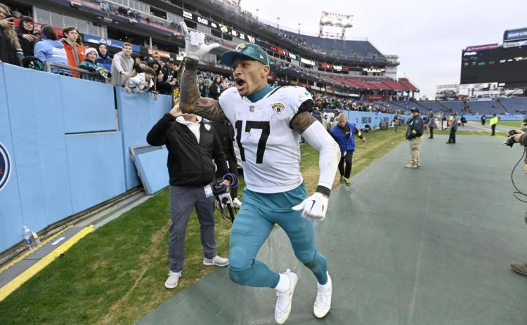 Jacksonville Jaguars tight end Evan Engram celebrates as he runs off the field a following 36-22 victory over the Tennessee Titans on Sunday in Nashville, Tenn. (MARK ZALESKI/Associated Press)