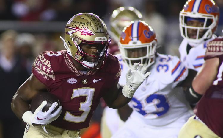 Florida State running back Trey Benson runs for a touchdown against Florida on Nov. 25 in Tallahassee. (AP FILE)