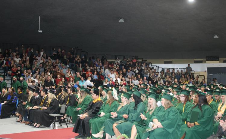 Florida Gateway College students listen during Thursday’s graduation ceremony in front of friends and family in attendance at the Howard Center. (TONY BRITT/Lake City Reporter)