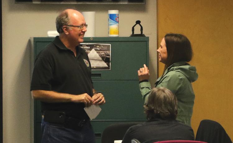 Emergency Management Director Shayne Morgan (left) and county spokeswoman Paula Vann converse at the county’s Combined Communications Center during Hurricane Ian’s landfall in September. Morgan will now be part of the team managing logistics for Gov. Ron DeSantis’ inauguration ceremony next week. (FILE)