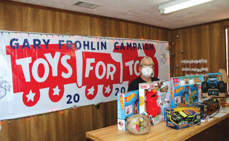 Toys for Tots Coordinator Inga Dwyer sorts through donated toys back in 2020. After giving out toys last week for Christmas, the organization is looking for a new location to provide services. (FILE)