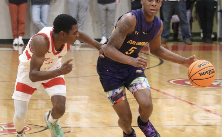 Columbia guard Jerome Carter dribbles up the court against Santa Fe last Friday. (JORDAN KROEGER/Lake City Reporter)