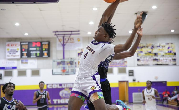 Columbia forward Ty'jahn Wright flies down the baseline for a dunk against Impact Christian Academy last Thursday. (BRENT KUYKENDALL/Lake City Reporter)