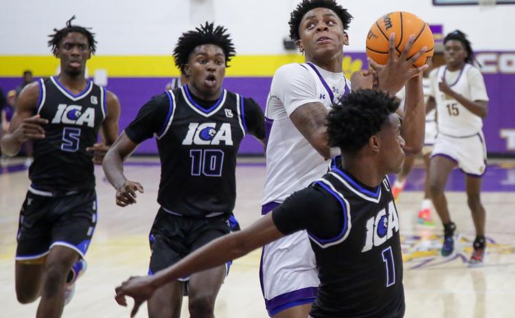 Columbia guard Jerome Carter drives to the basket against Impact Christian Academy on Jan. 19. (BRENT KUYKENDALL/Lake City Reporter)