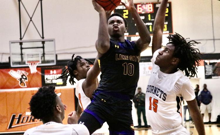 Columbia guard Isaac Broxey puts up a floater against Hawthorne on Thursday night. (JORDAN KROEGER/Lake City Reporter)