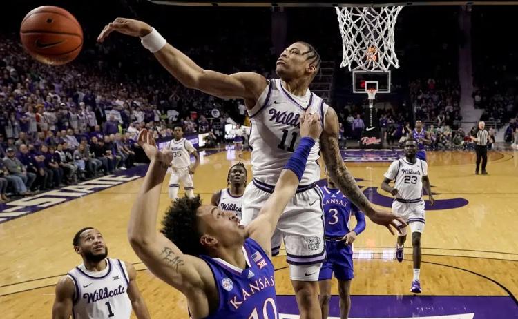 Kansas State forward Keyontae Johnson blocks a shot by Kansas forward Jalen Wilson on Jan. 17 in Manhattan, Kan. (CHARLIE RIEDEL/Associated Press)