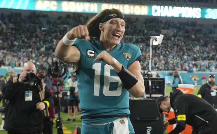 Jacksonville Jaguars quarterback Trevor Lawrence celebrates after defeating the Tennessee Titans on Saturday in Jacksonville. The Jaguars won 20-16. (JOHN RAOUX/Associated Press)