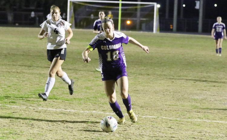 Columbia’s Skyler Ziegaus dribbles the ball up the field against Middleburg on Thursday night. (MORGAN MCMULLEN/Lake City Reporter)