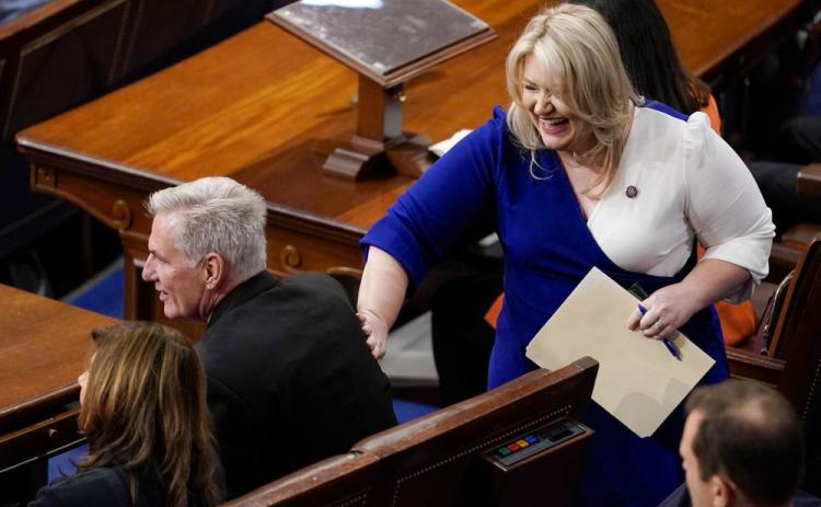 Rep. Kat Cammack, R-Fla., pats Rep. Kevin McCarthy, R-Calif., on the back after she nominated him as speaker for the sixth round of voting in the House chamber as the House meets for a second day to elect a speaker and convene the 118th Congress in Washington on Wednesday. (ANDREW HARNIK/Associated Press)