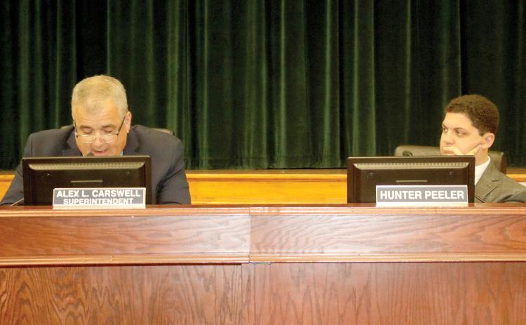 Hunter Peeler (right), the school board member for District 5, suggested to Superintendent Lex Carswell the district resume live-streaming board meetings. (TONY BRITT/Lake City Reporter)