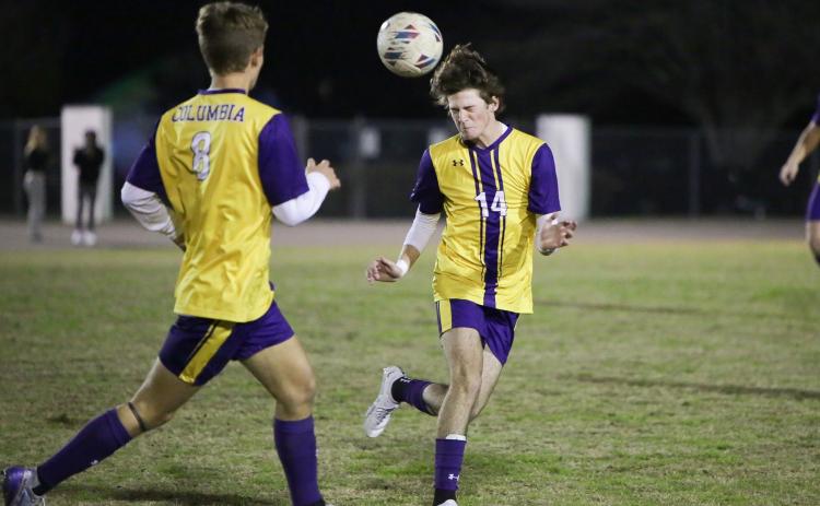Columbia’s Bobby Shotwell heads a ball Tuesday night against Palatka. (BRENT KUYKENDALL/Lake City Reporter)