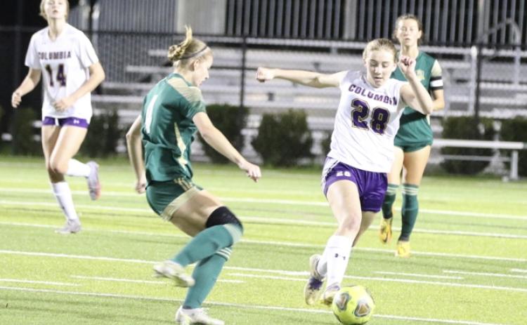 Columbia’s Kyndall Norris dribbles past Lincoln’s Izzy Young during Wednesday’s District 2-5A championship in Tallahassee. (MORGAN MCMULLEN/Lake City Reporter)