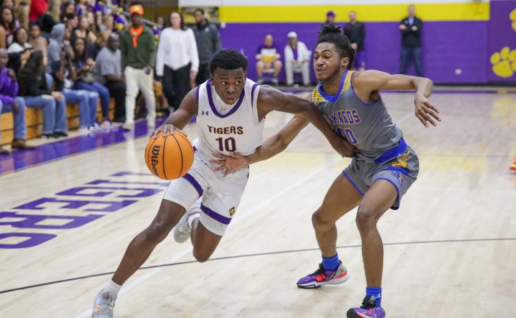 Columbia guard Isaac Broxey drives to the basket against Rickards during the District 2-5A championship on Friday. (BRENT KUYKENDALL/Lake City Reporter)