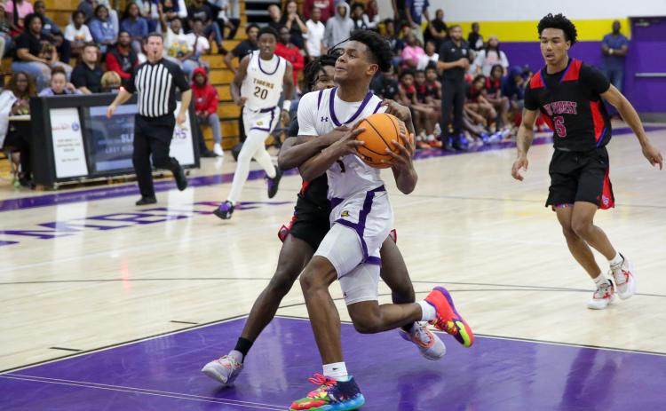 Columbia guard Jerome Carter is fouled in transition by Pine Forest during Thursday’s Region 1-5A quarterfinal. (BRENT KUYKENDALL/Lake City Reporter)