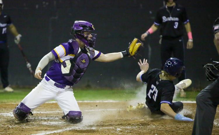 Kolt Myers slides into home plate safely, beating a tag from Columbia catcher Hayden Gustavson on Wednesday night. (BRENT KUYKENDALL/Lake City Reporter)