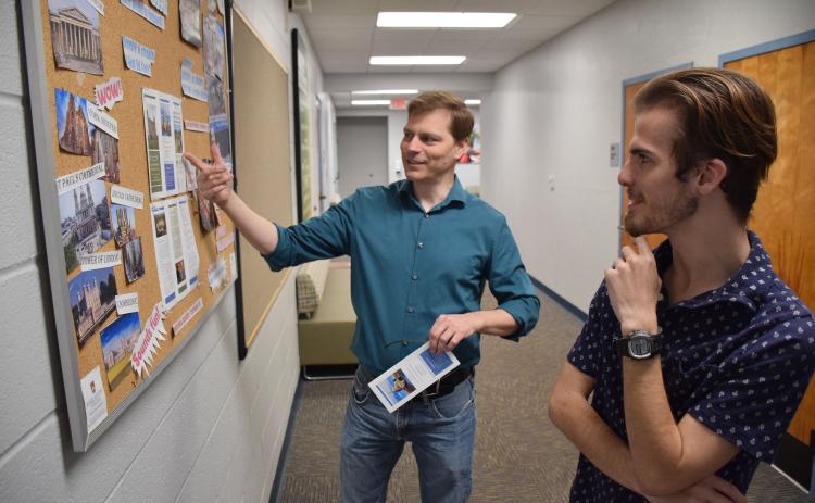 Florida Gateway College student Cade Mesnard (right) and FGC instructor Michael Baker discuss the college’s Study Abroad Program, which will take place in the United Kingdom. (COURTESY)