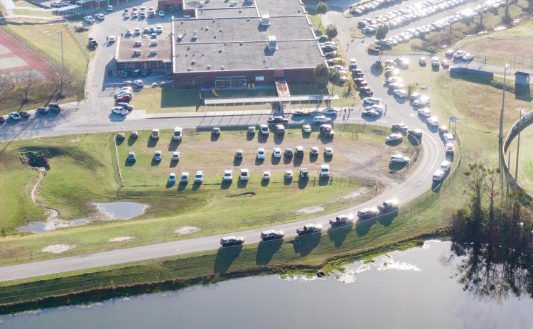 Law enforcement vehicles line the road into Columbia High School on Thursday morning after a call of an armed person on campus. The armed person turned out to be a JROTC cadet bringing back a non-functioning training rifle. (RAY CARPENTER/Special to the Reporter)