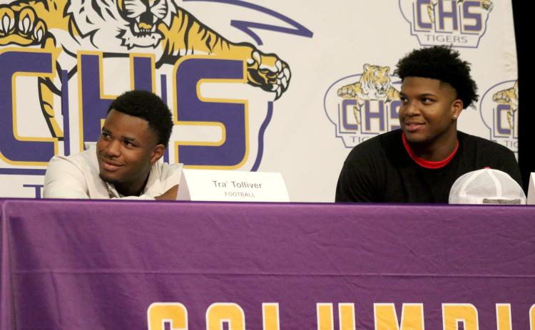 Columbia receiver Tra' Tolliver (left) signed his letter of intent with Iowa Central Community College on Wednesday, while defensive end Rashod Bradley (right) signed with East Mississippi Community College. (JAMIE WACHTER/Lake City Reporter)
