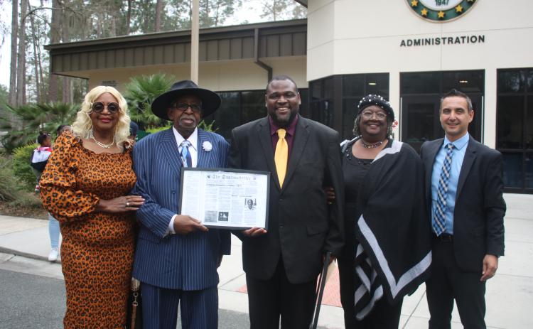 Mercilee Brown (from left) and her Rodney Brown, the first African American student to attend Lake City Junior College stand with Travis George, Lelia Williams and Tony Cardenas during an FGC Black History Month Proclamation ceremony on Tuesday morning. (TONY BRITT/Lake City Reporter)
