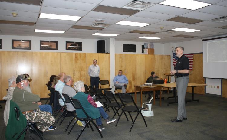 Gerry Dedenbach (standing, far right), CHW executive vice president, details plans for Hunter’s Creek, a planned residential development, that could be built across from the southern entrance of the Southside Sports Complex. (TONY BRITT/Lake City Reporter)