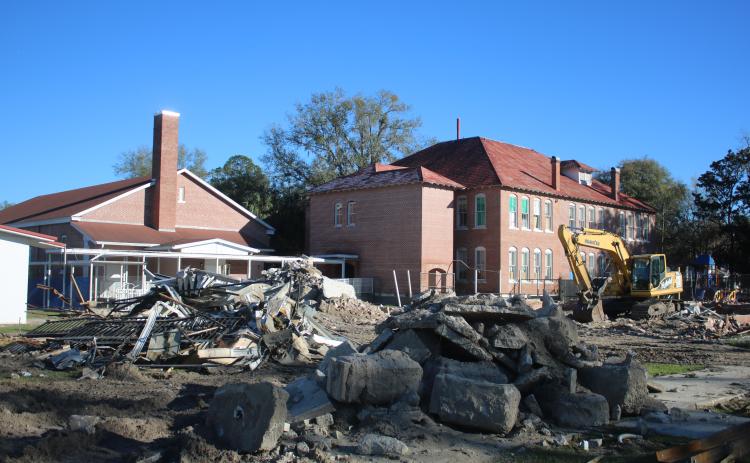 An excavator is pictured near ‘The Fort’ on the Fort White Elementary School campus on Monday afternoon. (TONY BRITT/Lake City Reporter)