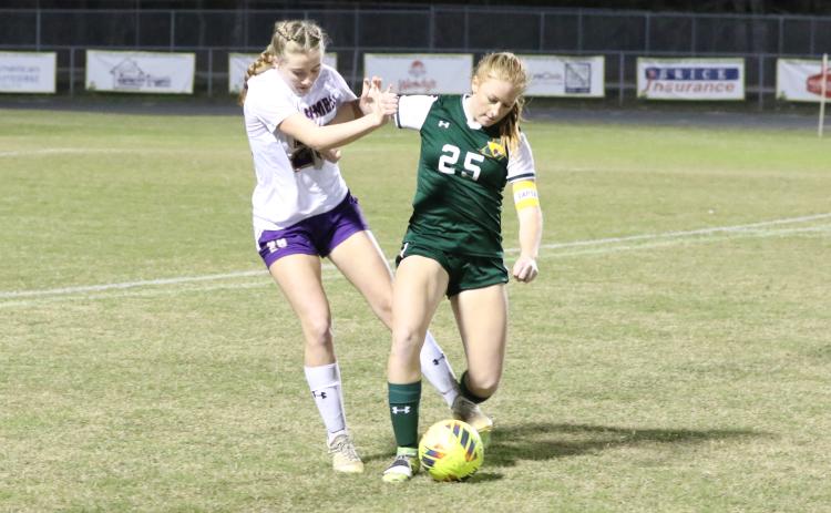 Lecanto’s Mallory Mushlit fights off Columbia’s Kyndall Norris to corral possession of the ball during Tuesday’s Region 1-5A quarterfinal. (MORGAN MCMULLEN/Lake City Reporter)
