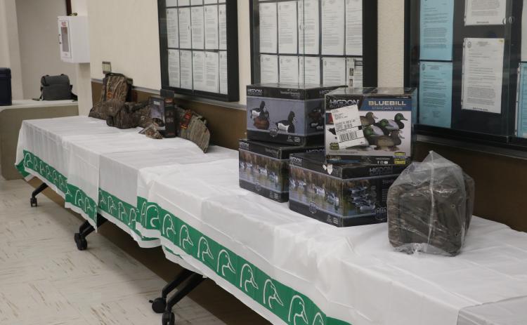The Suwannee River Chapter of Ducks Unlimited set up raffle prizes ahead of Friday's annual banquet. (MORGAN MCMULLEN/Lake City Reporter)
