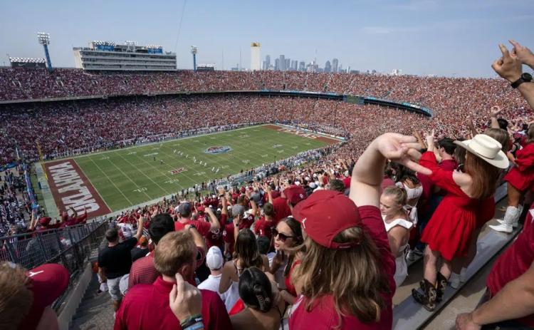 Oklahoma and Texas fans cheer at the Cotton Bowl on Oct. 8, 2022, in Dallas. (JEFFREY MCWHORTER/Associated Press)