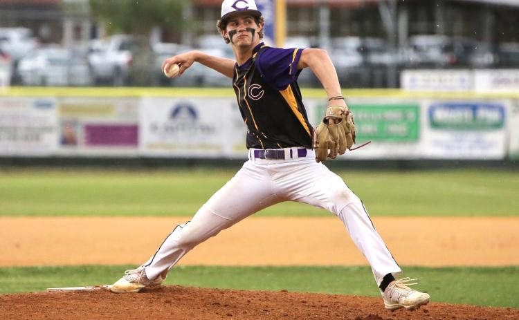 Columbia pitcher Bynton Edge winds up to pitch during Tuesday's game against Union County that was postponed due to rain. (BRENT KUYKENDALL/Lake City Reporter)