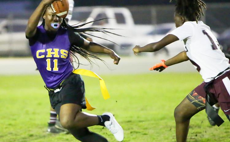 Columbia quarterback Eriel Baker scrambles away from defensive pressure against Madison County on Tuesday night. (BRENT KUYKENDALL/Lake City Reporter)