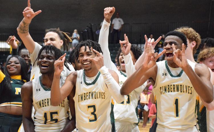 FGC players Maurice Campbell (15), Jeremy Young (3) and Jeremiah Barze (1) celebrate after defeating Palm Beach State to win the Region 8 title on Saturday. (COURTESY OF FGC)