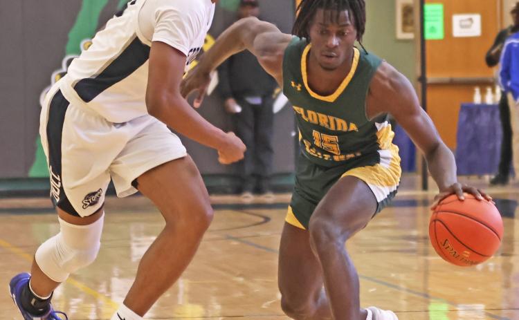 FGC guard Maurice Campbell dribbles while being defended by Davidson-Davie guard Jonathan Foust during the first round of the NJCAA tournament on Tuesday. (COURTESY OF NJCAA)