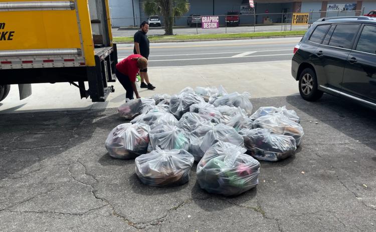 More than 1,000 pairs of shoes were collected during the Greater Lake City Community Development Corporation and Young Women of Excellence’s shoe drive. (COURTESY)