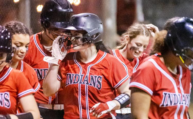 Fort White pitcher Kadence Compton celebrates with teammates after hitting a home run against Lafayette on Tuesday night. (JACK HOWDESHELL/Special to the Reporter)