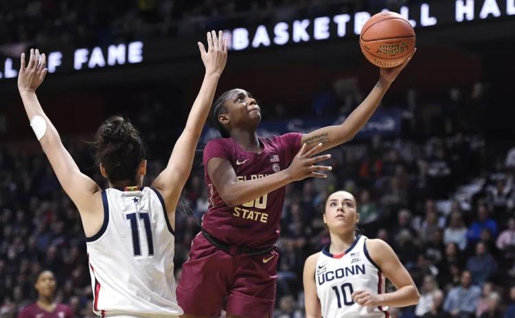 Florida State’s Ta’niya Latson goes up for a basket as Connecticut’s Lou Lopez-Senechal (11) defends on Dec. 18, 2022, in Uncasville, Conn. (JESSICA HILL/AP File)