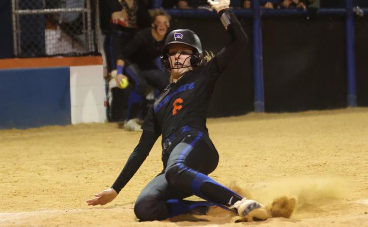 Branford’s Madyson Sikes slides into home plate to score the game-winning run against Suwannee on April 11. (PAUL BUCHANAN/Special to the Reporter)
